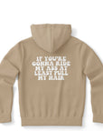 Brown hoodie with small white melting smiley face and arched “CollegeWares” text logo on the front left chest — minimal drip-core design from CollegeWares.
