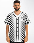 Front of a black-and-white checkerboard baseball jersey worn by a man. The chest features the “Cyclops Vision Center” circular crest with a bold black-and-green eye logo. Black piping lines the button-up center. Sleeves show green-eye patches on both sides.