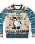 Beige and blue sweater with snowman bent over and “How Snowflakes Are Really Made” text — funny and inappropriate holiday humor by CollegeWares.