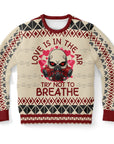 Beige Christmas sweater with red hearts, gas mask skull, and “Love Is in the Air Try Not to Breathe” slogan — edgy holiday style from CollegeWares.