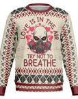 Beige Christmas sweater with red hearts, gas mask skull, and “Love Is in the Air Try Not to Breathe” slogan — edgy holiday style from CollegeWares.