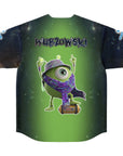 Flat back view of a green-to-black galaxy gradient jersey featuring a one-eyed green creature wearing a patterned hat and scarf, standing on a small speaker, with the word “WUBZOWSKI” printed above.
