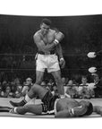 Black and white flag featuring Muhammad Ali standing over Sonny Liston after a KO — classic sports history moment printed as badass dorm room or man cave decor for alpha vibes from CollegeWares.