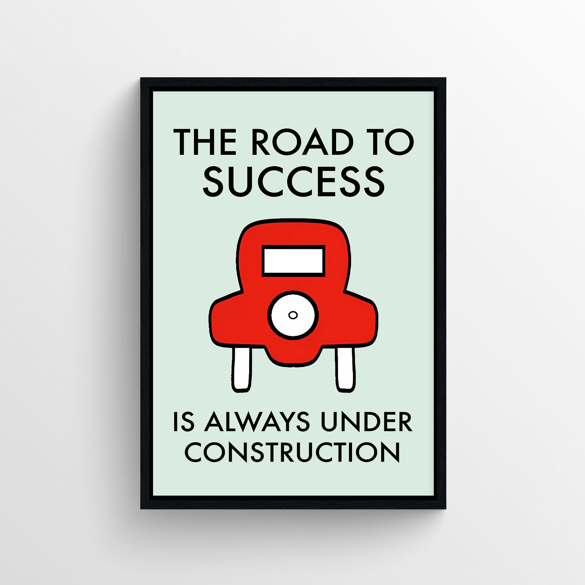 Poster featuring the full phrase “The Road to Success Is Always Under Construction” in all-caps black text. The design includes a bold red cartoon car centered between the two lines of text, symbolizing progress and persistence through constant challenges. Clean background with a subtle mint green tone — whimsical yet inspiring decor from CollegeWares.
