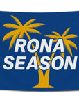 Blue flag with bold white text that says “Rona Season” featuring yellow palm trees — funny beach-themed dorm banner for party lovers and beer drinkers from CollegeWares.