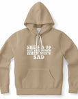 Brown hoodie featuring “She’s a 10 But She Shops When She’s Sad” in thick white retro letters — cheeky sad girl aesthetic from CollegeWares.