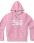 Pink hoodie with chunky white retro letters that say “She’s a 10 But So Is Her Anxiety” — chaotic mental health humor from CollegeWares.