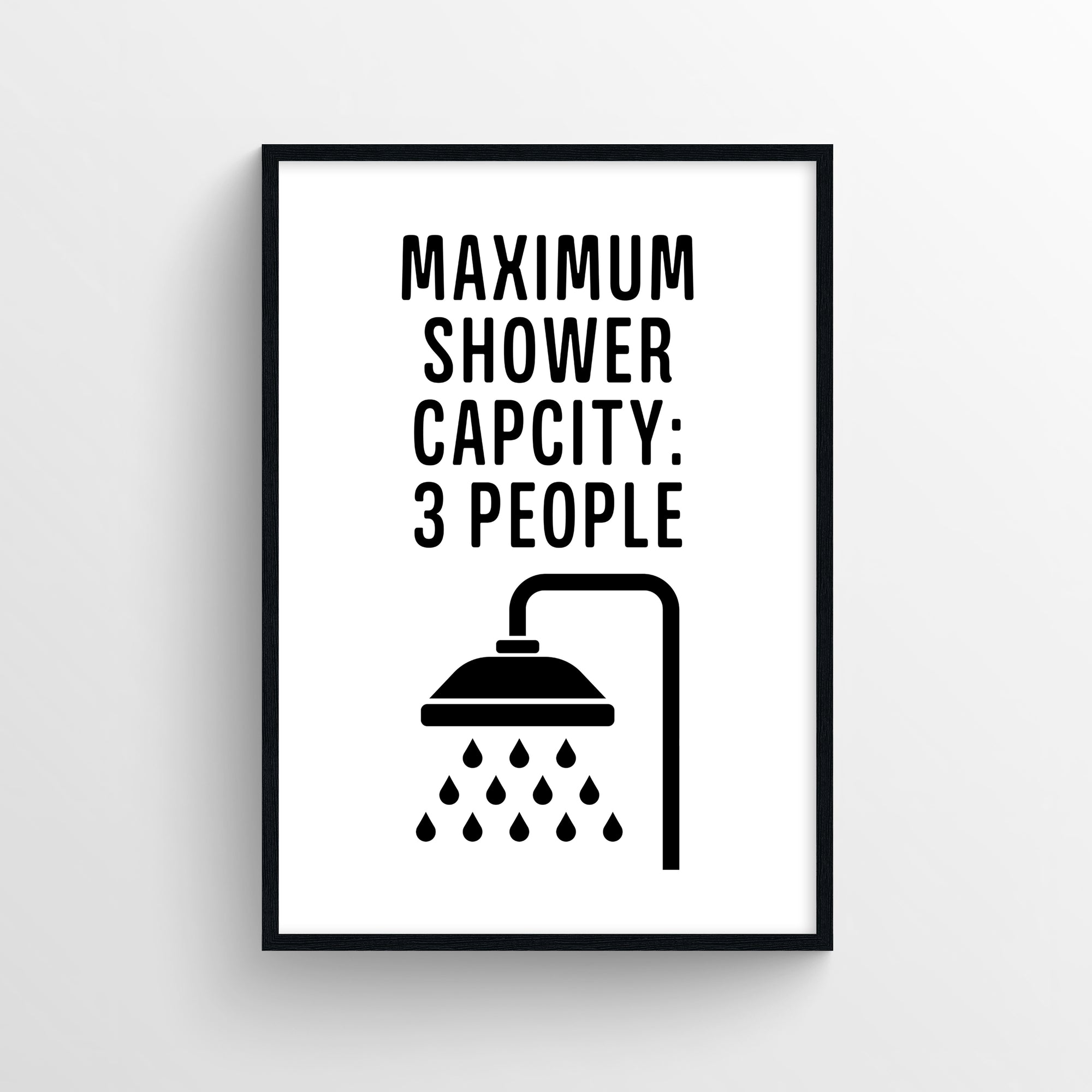 Poster with the phrase “Maximum Shower Capacity: 3 People” in bold black block text, stacked above a simple black showerhead icon releasing 12 water droplets. The clean white background gives it a minimalist, tongue-in-cheek appearance — perfect naughty dorm humor from CollegeWares.