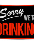 Black flag that reads “Sorry We’re Drinking” in vintage script and block font, with red and white lettering — classic pregame decor from CollegeWares.
