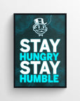 Motivational poster with the phrase “Stay Hungry. Stay Humble.” displayed in bold lettering, with “Hungry” and “Humble” glowing in electric blue for emphasis. Features a glowing wireframe pattern background and a neon-styled character icon up top — a vibrant CollegeWares exclusive designed for driven students.