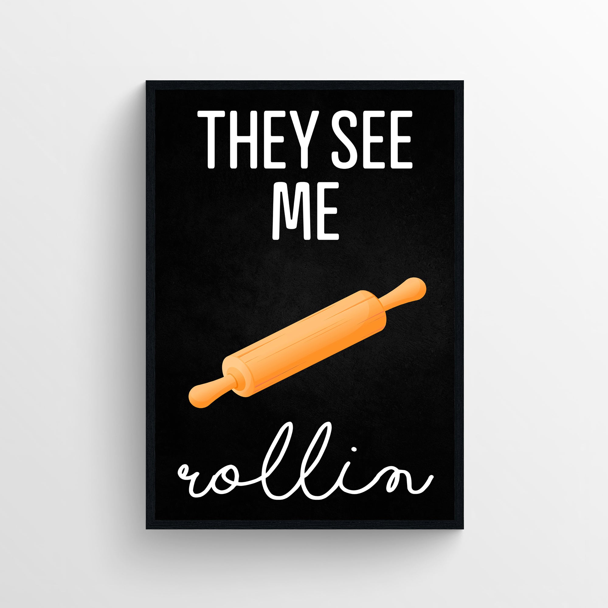 Poster with the quote “They See Me Rollin’” in white, split across the top and bottom of a central orange rolling pin illustration. The background is solid matte black, making the cursive word “rollin” pop in stylized script below the graphic. Perfect blend of baking humor and hip-hop reference — funny kitchen decor by CollegeWares.