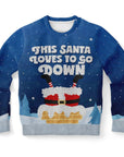 Blue Christmas sweater with pixel-style Santa stuck upside down in a chimney and “This Santa Loves to Go Down” text — funny holiday design from CollegeWares.