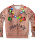 nude-tone Christmas sweater with hairy chest, holiday light necklace, and tattoo graphics reading “Xmas Life” — wild and funny from CollegeWares.