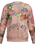 nude-tone Christmas sweater with hairy chest, holiday light necklace, and tattoo graphics reading “Xmas Life” — wild and funny from CollegeWares.