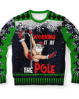 Black and green Christmas sweater with Santa pole dancing and “Working It at the Pole” slogan — naughty holiday humor from CollegeWares.