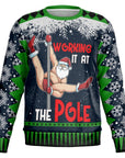 Black and green Christmas sweater with Santa pole dancing and “Working It at the Pole” slogan — naughty holiday humor from CollegeWares.