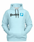 Light blue hoodie with bold black gothic font reading “Pushin” and a bright blue parking “P” icon — trendy rap-inspired hoodie from CollegeWares.