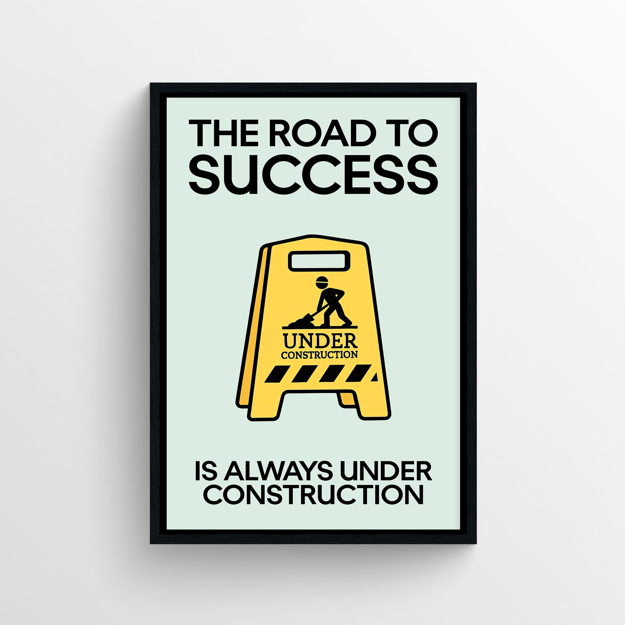 Motivational poster with bold text reading “The Road to Success Is Always Under Construction” and a yellow construction sign graphic — modern aesthetic wall decor for dorms, study spaces, and offices by CollegeWares.