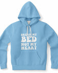 Light blue hoodie featuring the slogan “Break My Bed Not My Heart” in big bubble letters — flirty breakup humor from CollegeWares.