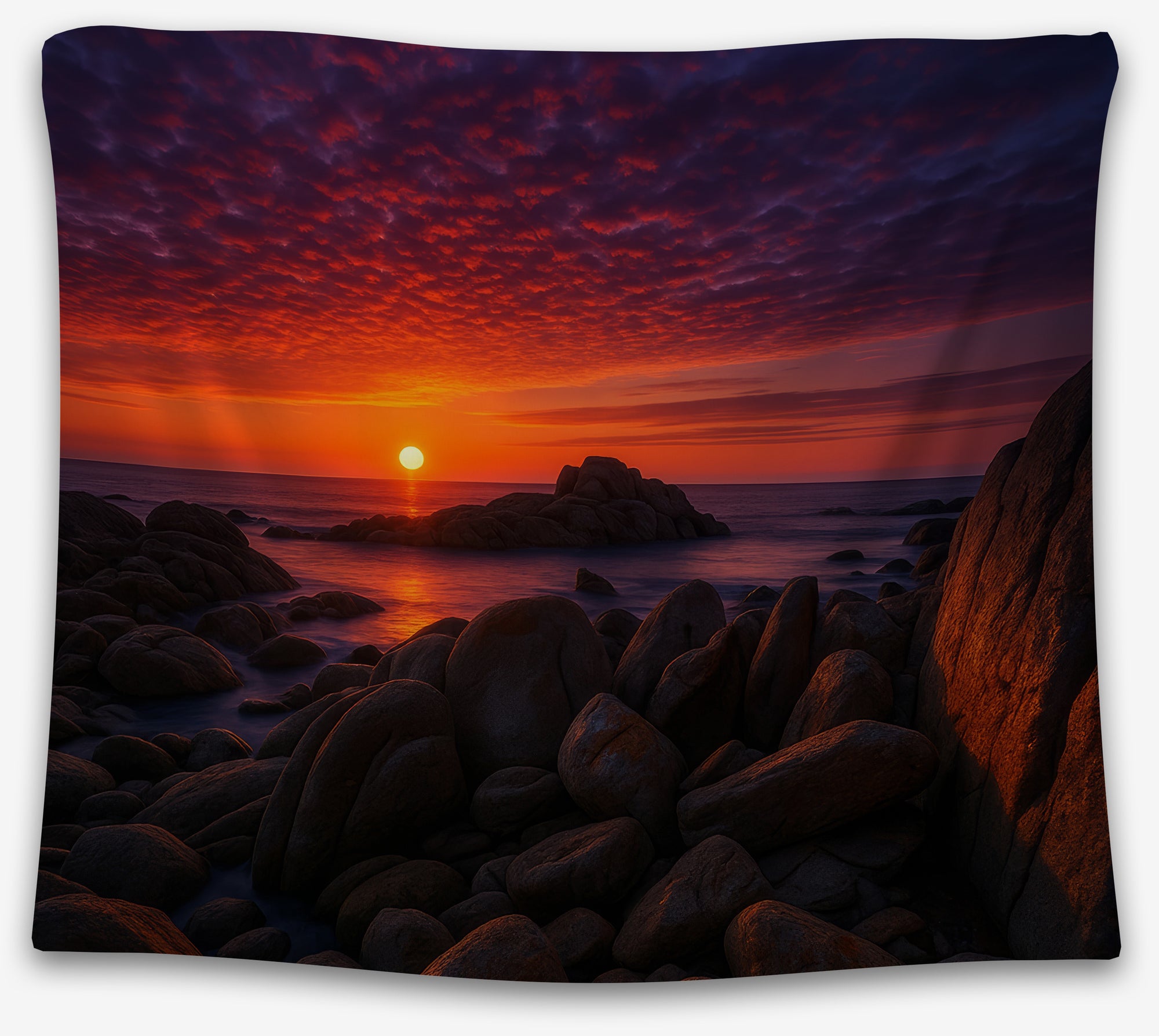 Sunset ocean tapestry with glowing red sky and rocky shoreline, perfect dramatic coastal wall art or dorm room decor by CollegeWares.