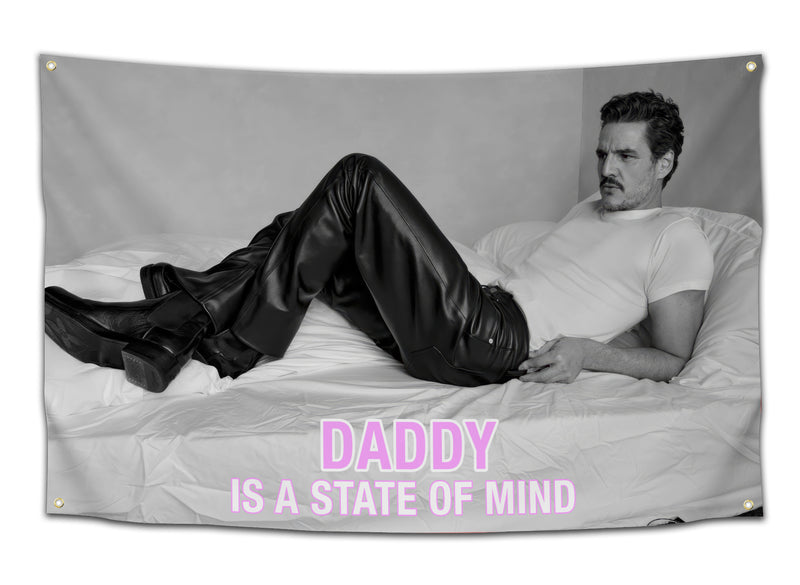 Black and white funny college flag featuring a reclining man on a bed with the phrase “Daddy Is a State of Mind” in bold pink text. This meme inspired dorm room banner brings flirty internet humor to college apartments, student bedrooms, and meme wall decor collections from CollegeWares.