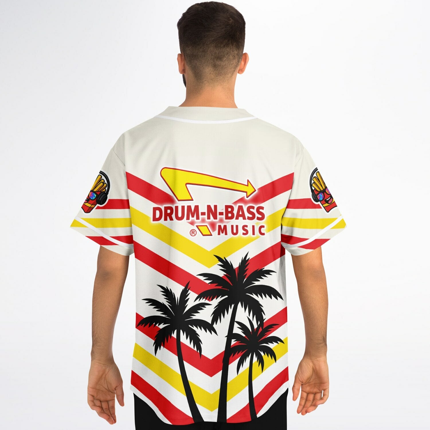 Man wearing the white IN-N-OUT parody jersey showing the angled red and yellow striping, Drum-N-Bass arrow logo near the shoulders, and palm-tree silhouettes at the lower back.