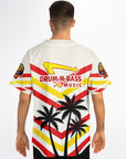 Man wearing the white IN-N-OUT parody jersey showing the angled red and yellow striping, Drum-N-Bass arrow logo near the shoulders, and palm-tree silhouettes at the lower back.