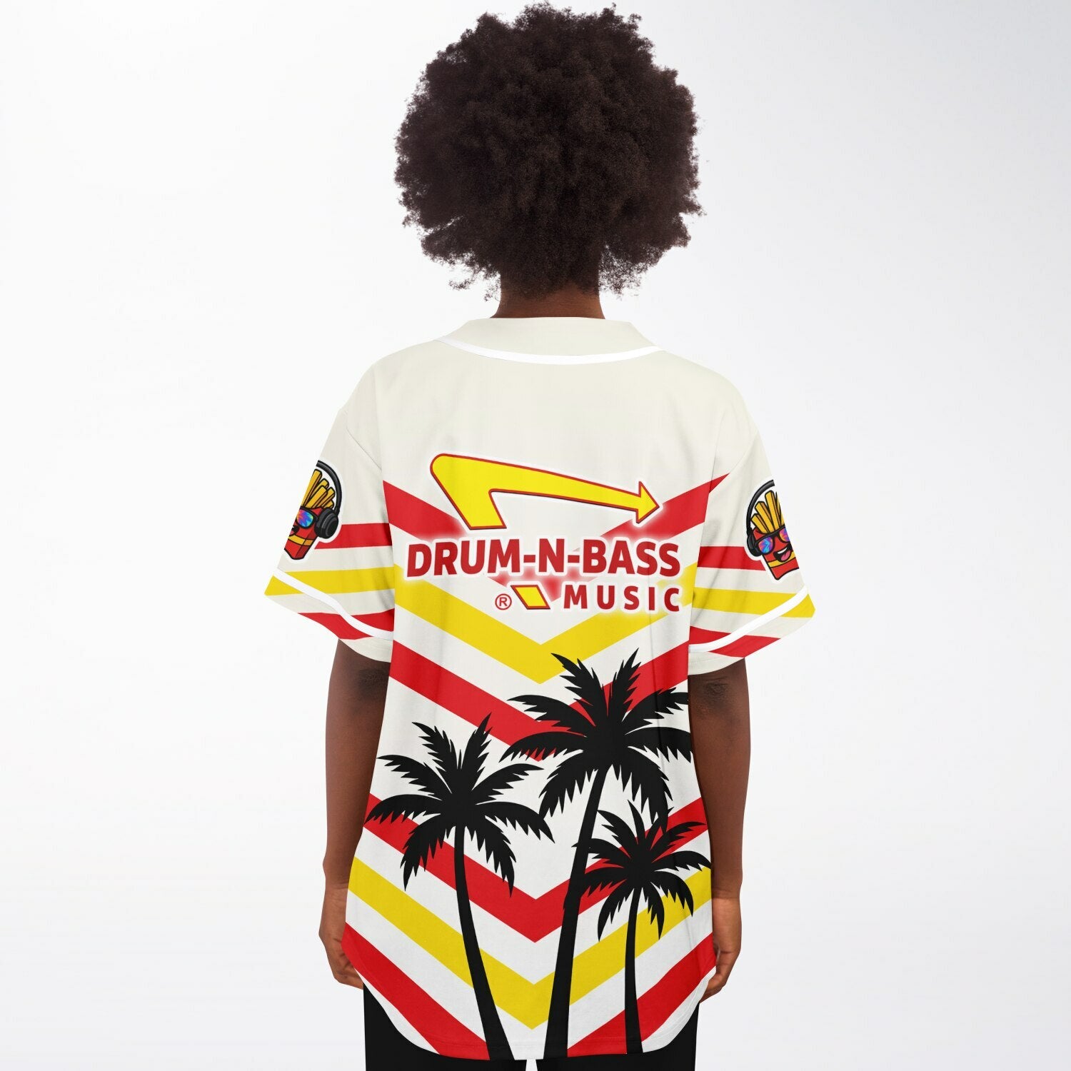 Back view of a woman wearing the IN-N-OUT–inspired Drum-N-Bass jersey, showing the red and yellow chevron layout, parody arrow logo across the upper back, and three black palm-tree silhouettes at the bottom.