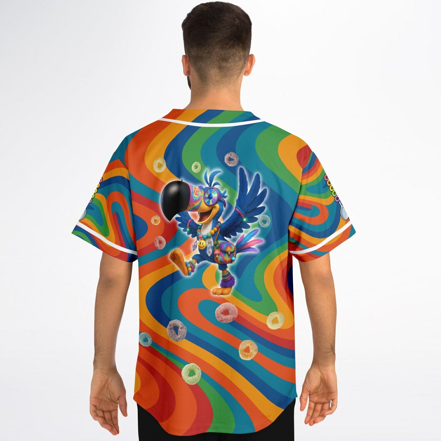 Man wearing the Froot Wooks rave jersey from the back. Features a dancing kandi-covered cartoon toucan surrounded by floating cereal loops on a rainbow psychedelic swirl background.