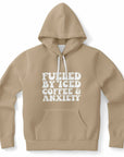 Tan hoodie featuring all-caps phrase “Fueled By Iced Coffee & Anxiety” in white letters — anxious energy aesthetic from CollegeWares.