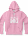 Pink hoodie with bold white bubble text reading “Fueled By Iced Coffee & Anxiety” on the front — caffeinated chaos vibes from CollegeWares.