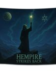 Minimalist “Hempire Strikes Back” flag showing a lone hooded figure raising a lit joint under a starry night sky and weed-themed constellations.