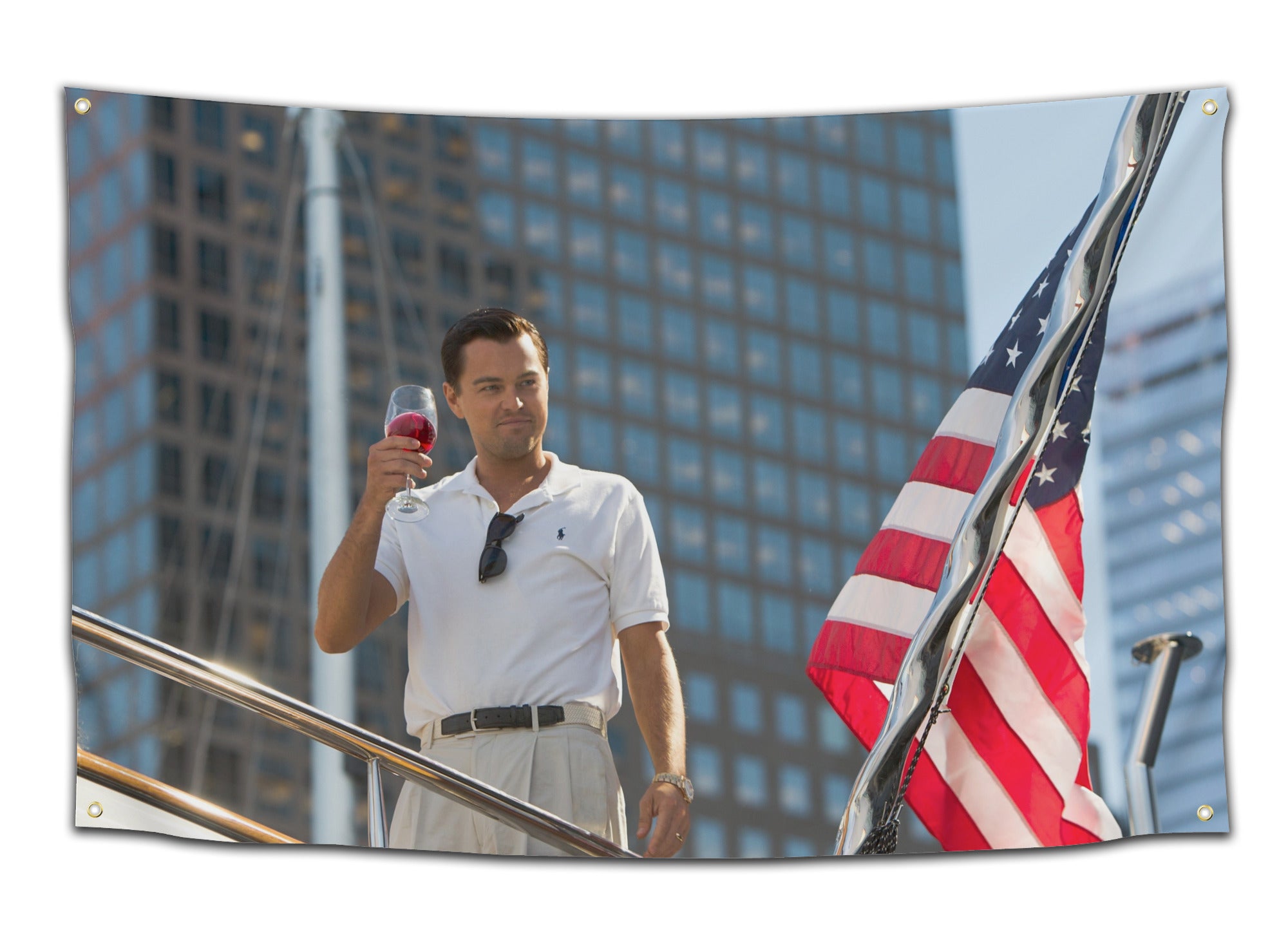 Flag showing scene of Leonardo DiCaprio in character as Jordan Belfort raising a wine glass aboard a yacht with an American flag in the background – iconic movie flag from CollegeWares.