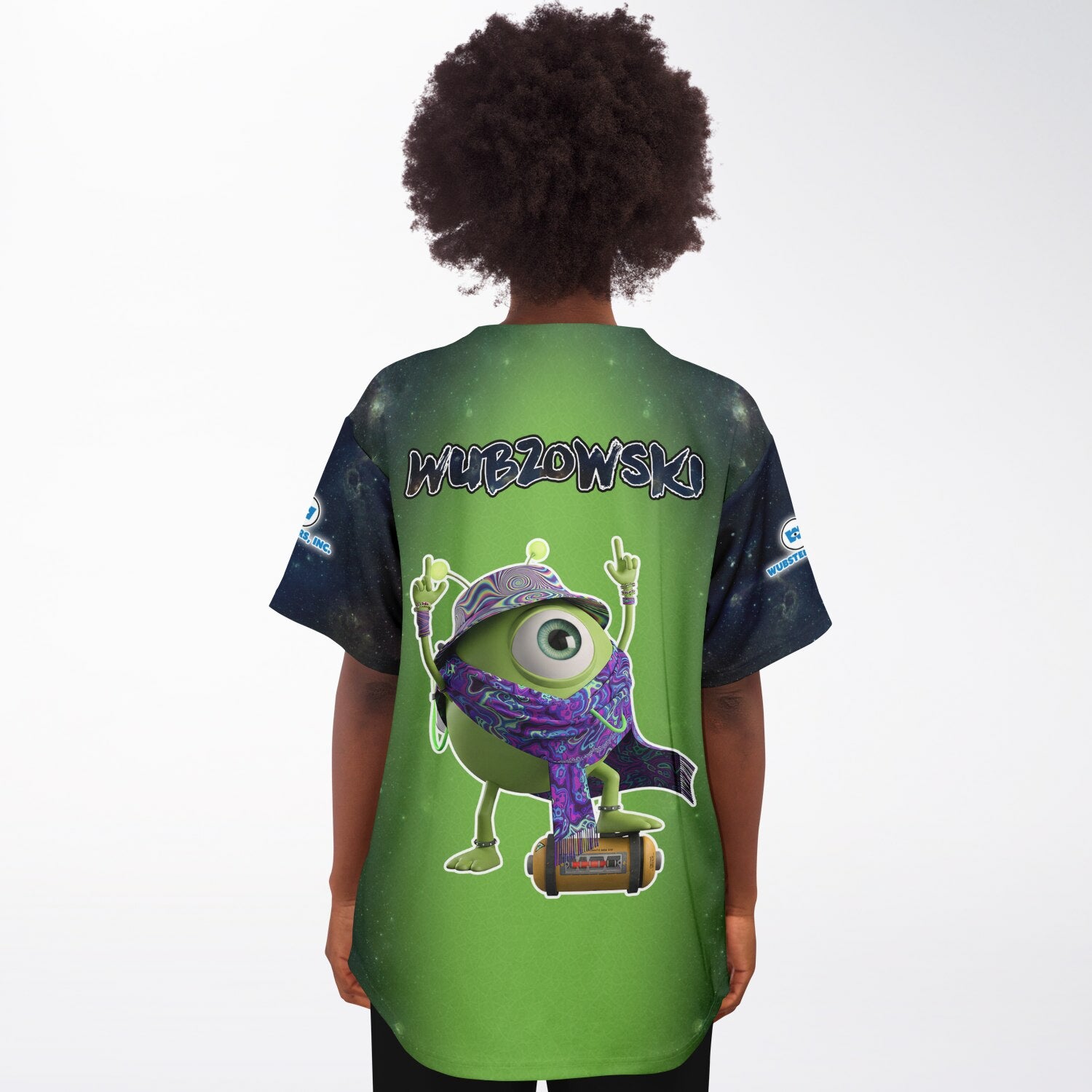 Back view of a woman wearing the green-to-black gradient jersey showing the one-eyed mascot standing on a speaker with the “WUBZOWSKI” text across the upper back.