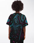 Woman wearing a black baseball jersey with neon cyan and magenta shard gradients and a large hooded skeleton reaper holding a trident centered on the back. Colors spread outward from the figure across both sleeves.