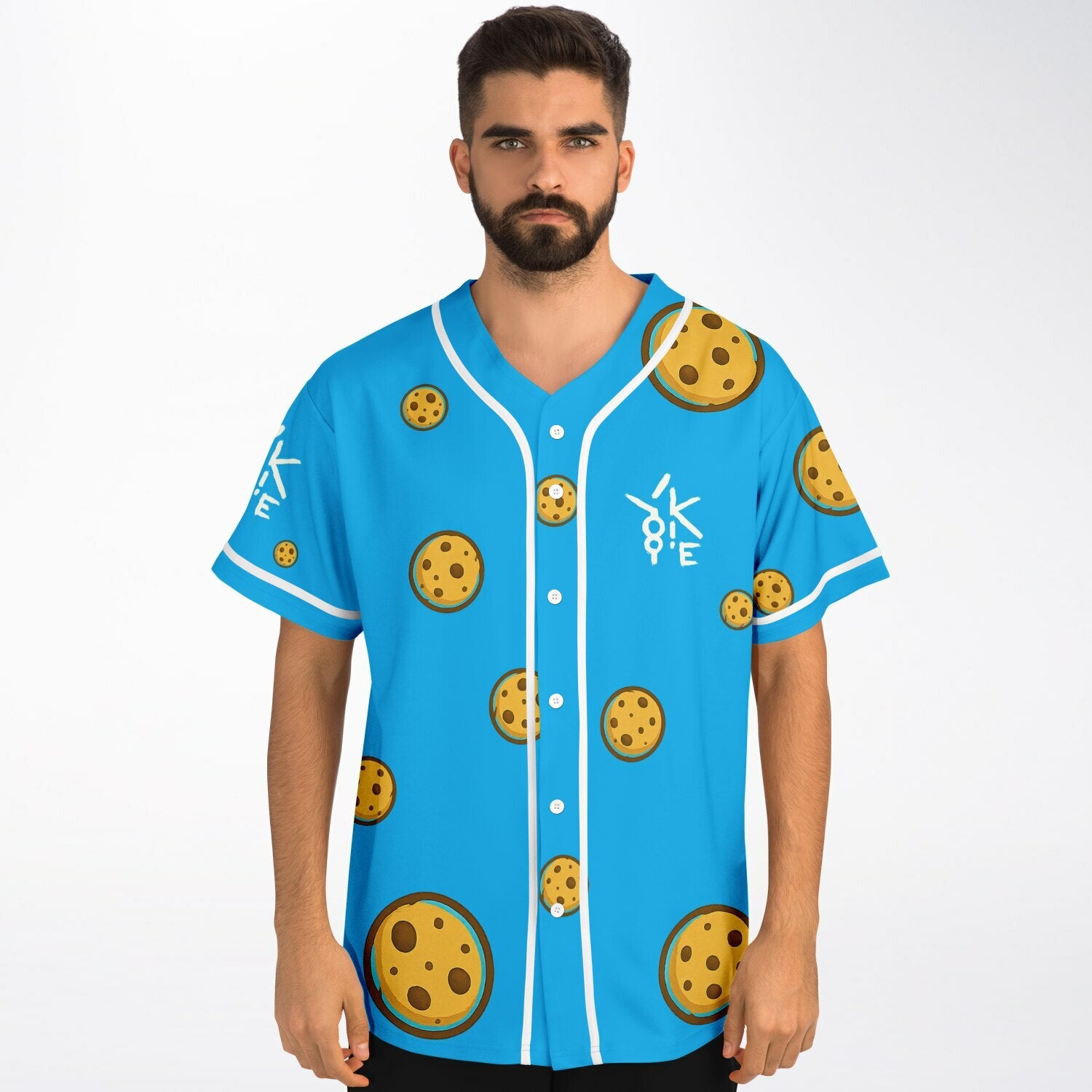 Male model wearing Yookie Crisp baseball jersey front view, bright blue with scattered cartoon cookies and white Yookie logo on the left chest.