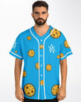 Male model wearing Yookie Crisp baseball jersey front view, bright blue with scattered cartoon cookies and white Yookie logo on the left chest.