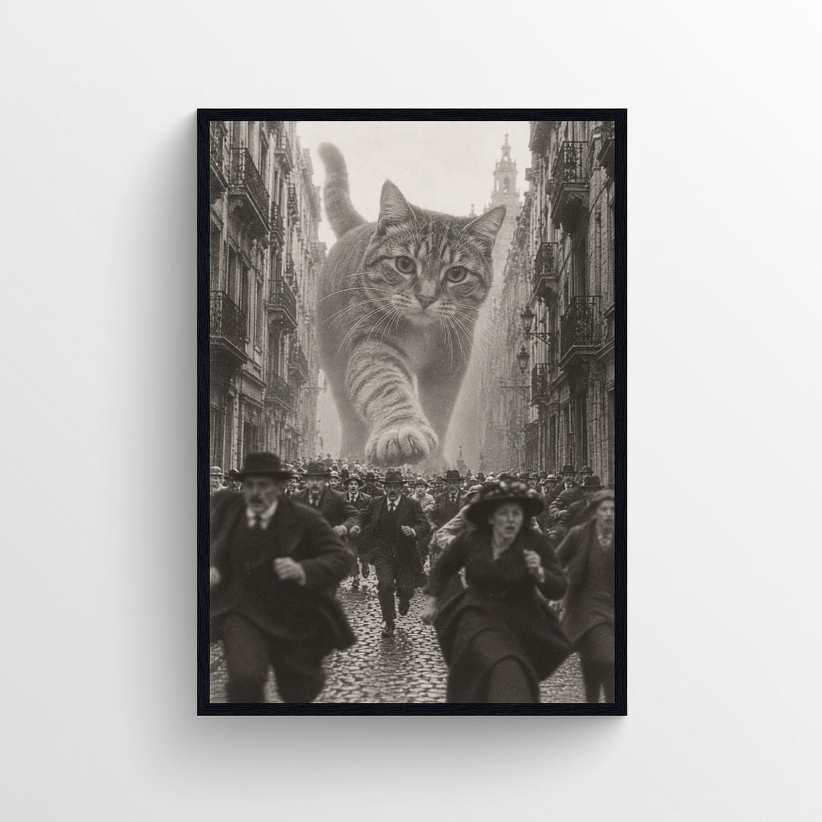 Black-and-white surreal poster showing a giant tabby cat prowling above a crowded historic city street as people run away — vintage-style wall art from CollegeWares.